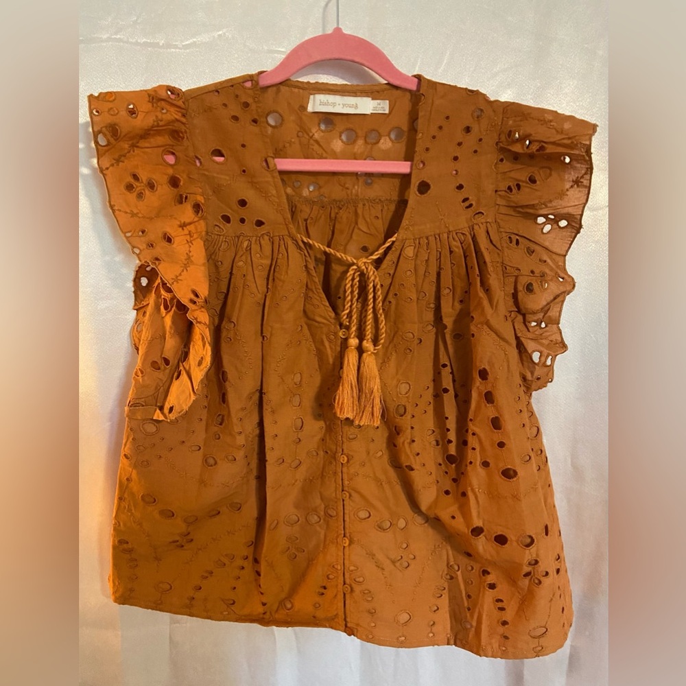 bishop + young rust eyelet tassel flutter top
